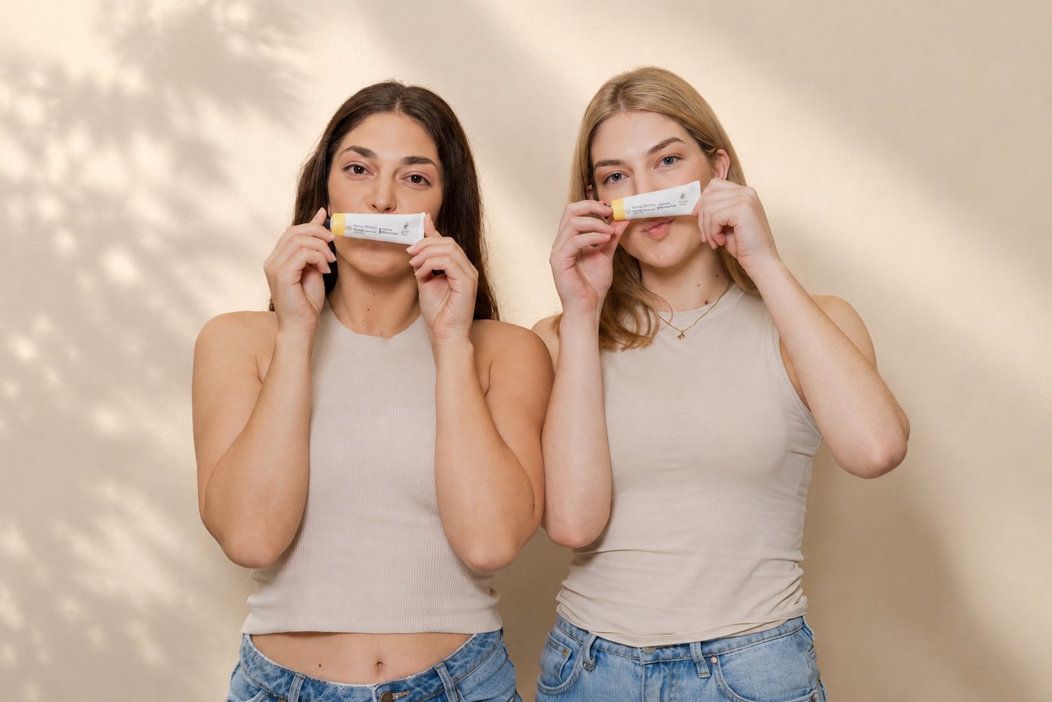 Two customers holding Honey Biotics Intense Moisturiser